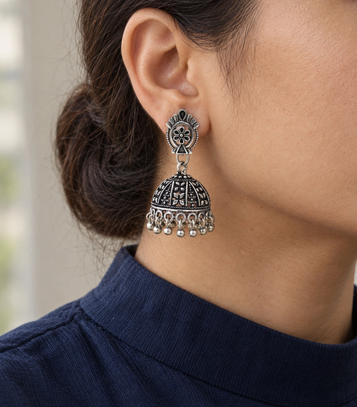JIMIKI Oxidized Silver Oval Flower Stud Panel Jhumka Earrings in Oxidized Silver - editorial worn view #color_oxidized-silver