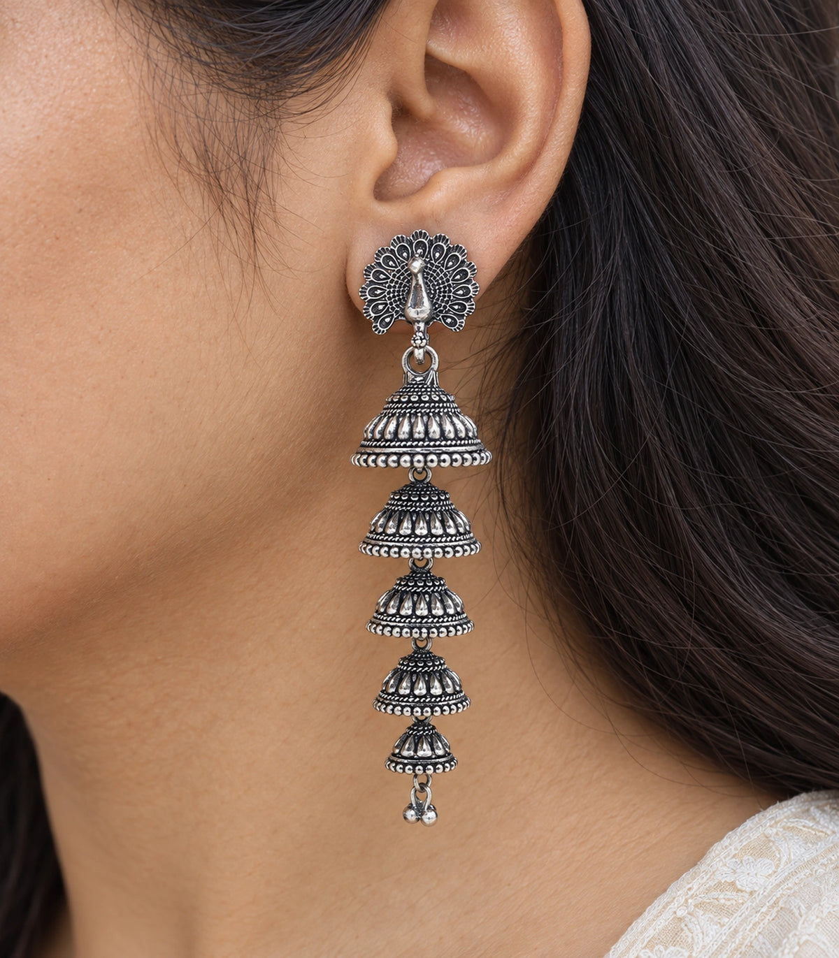 JIMIKI Peacock Five Tier Jhumka Earrings in Oxidized Silver - close-up details #color_oxidized-silver