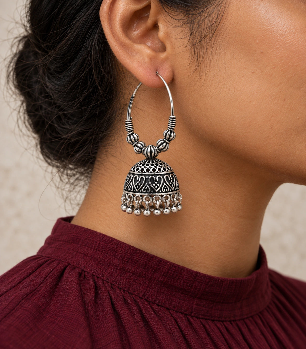 JIMIKI Oxidized Silver Ribbed Bead Hoop Heart Jhumka Earrings in Oxidized Silver - editorial worn view #color_oxidized-silver