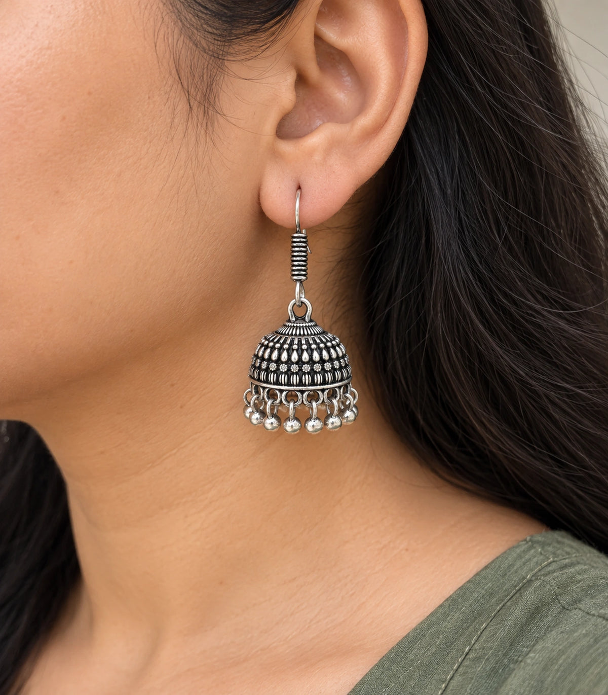 JIMIKI Oxidized Silver Rosette Teardrop Jhumka Earrings - earring worn with a clear view of the design #color_oxidized-silver