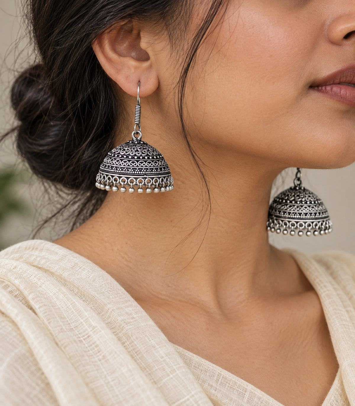 JIMIKI Oxidized Silver Scroll Dome Hook Jhumka Earrings - Oxidized Silver close-up of the earring worn #color_oxidized-silver