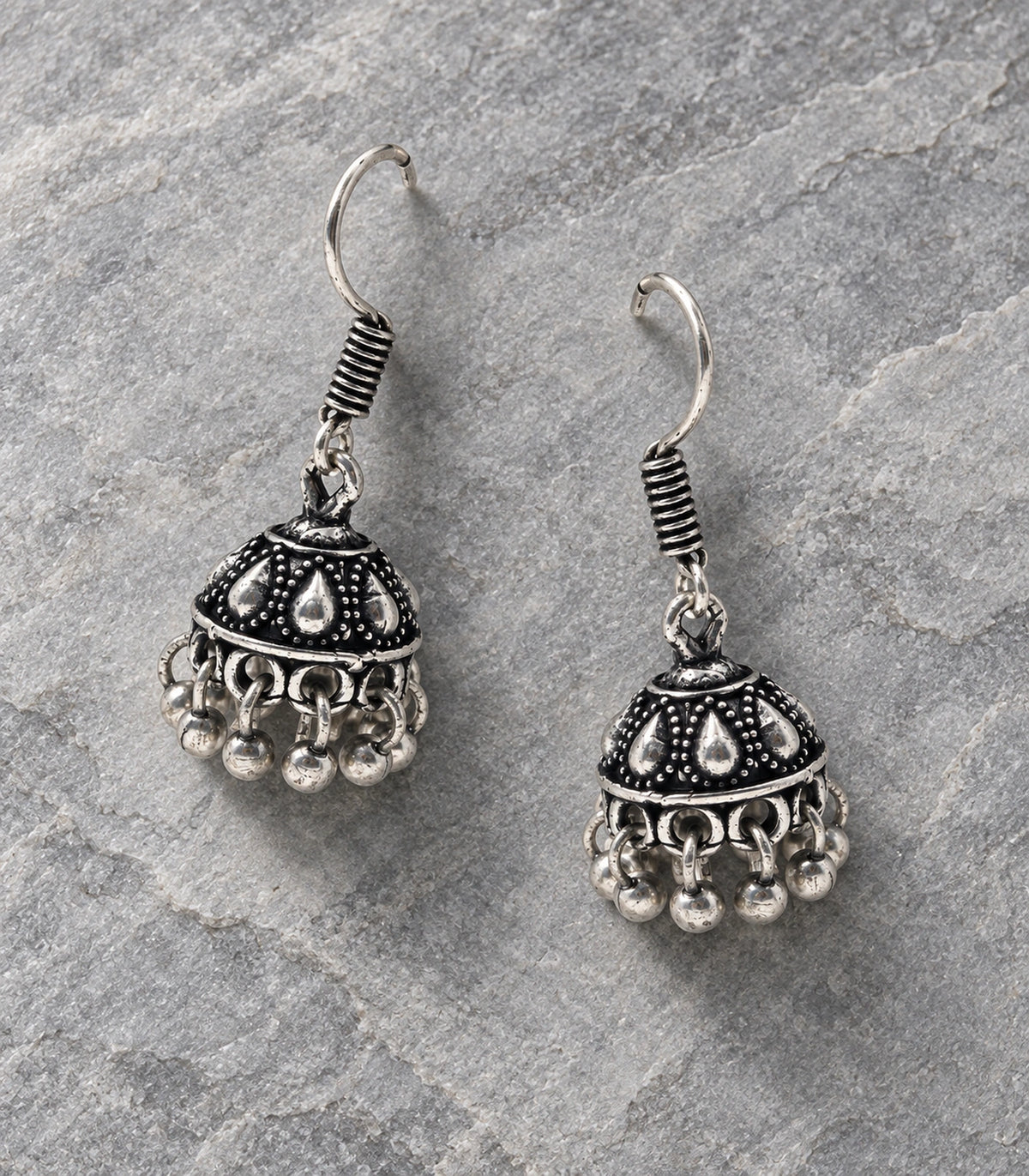 JIMIKI Oxidized Silver Teardrop Mini Jhumka Earrings - styled flatlay of the matching earrings #color_oxidized-silver