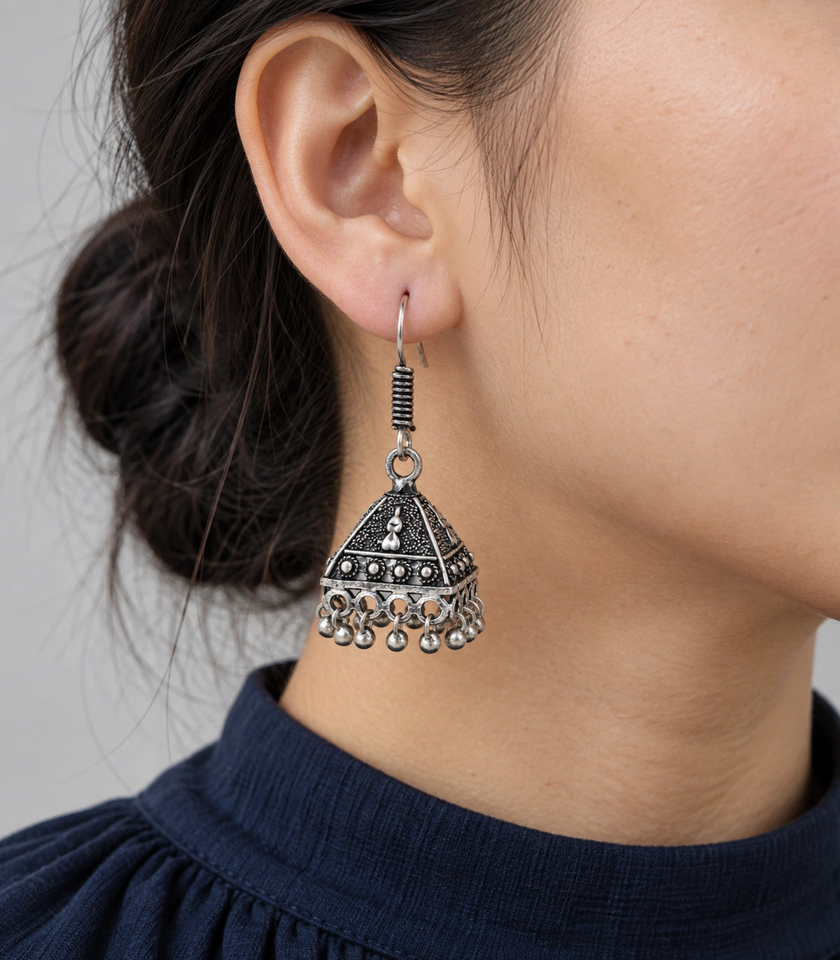 JIMIKI Oxidized Silver Teardrop Pyramid Jhumka Earrings - Worn styling view #color_oxidized-silver