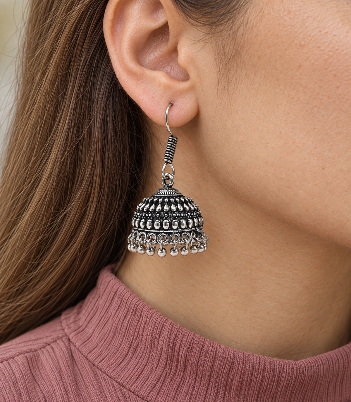 Oxidized silver-tone hook jhumka earrings worn with a traditional outfit #color_oxidized-silver