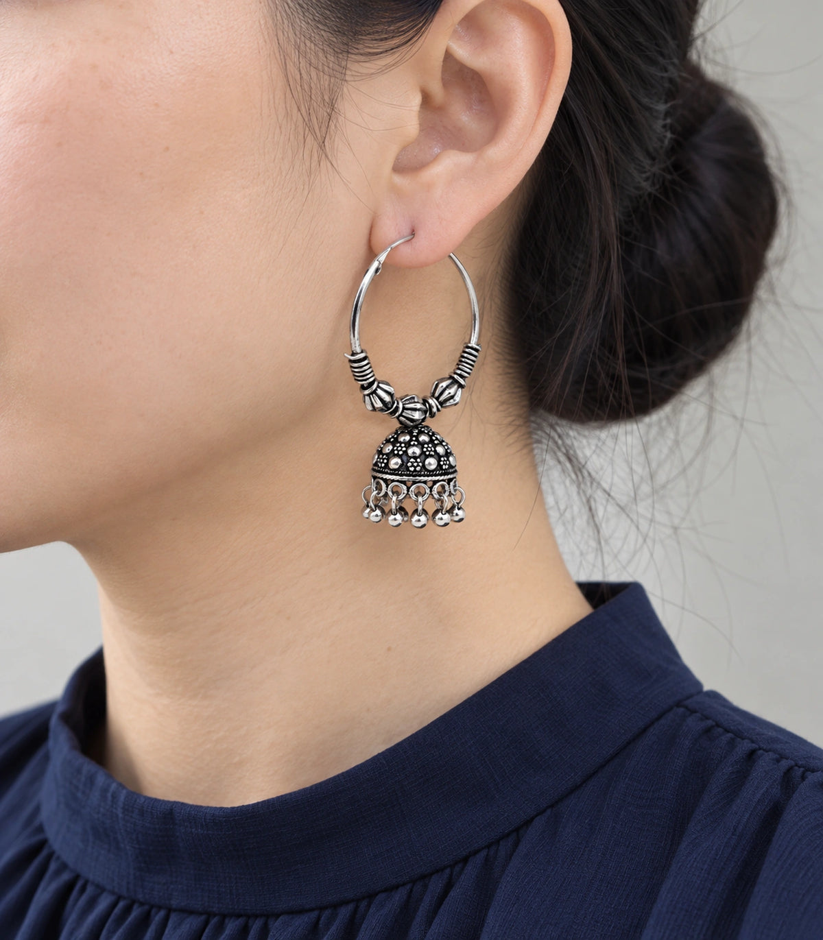 JIMIKI Oxidized Silver Three Bead Hoop Dotted Jhumka Earrings in Oxidized Silver - worn styling view #color_oxidized-silver