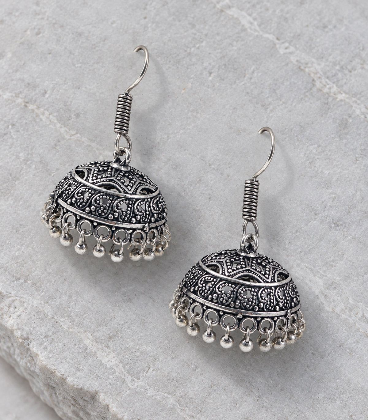 JIMIKI Oxidized Silver Wide Paisley Dome Hook Jhumka Earrings in Oxidized Silver - editorial flatlay #color_oxidized-silver