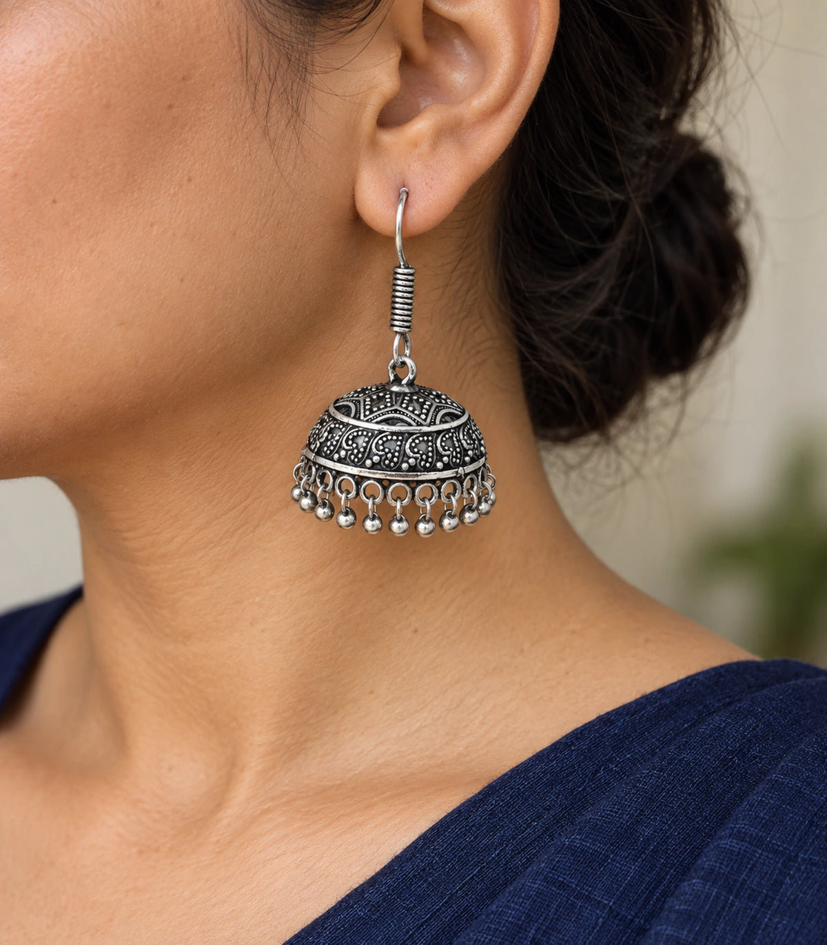 JIMIKI Oxidized Silver Wide Paisley Dome Hook Jhumka Earrings in Oxidized Silver - worn styling view #color_oxidized-silver