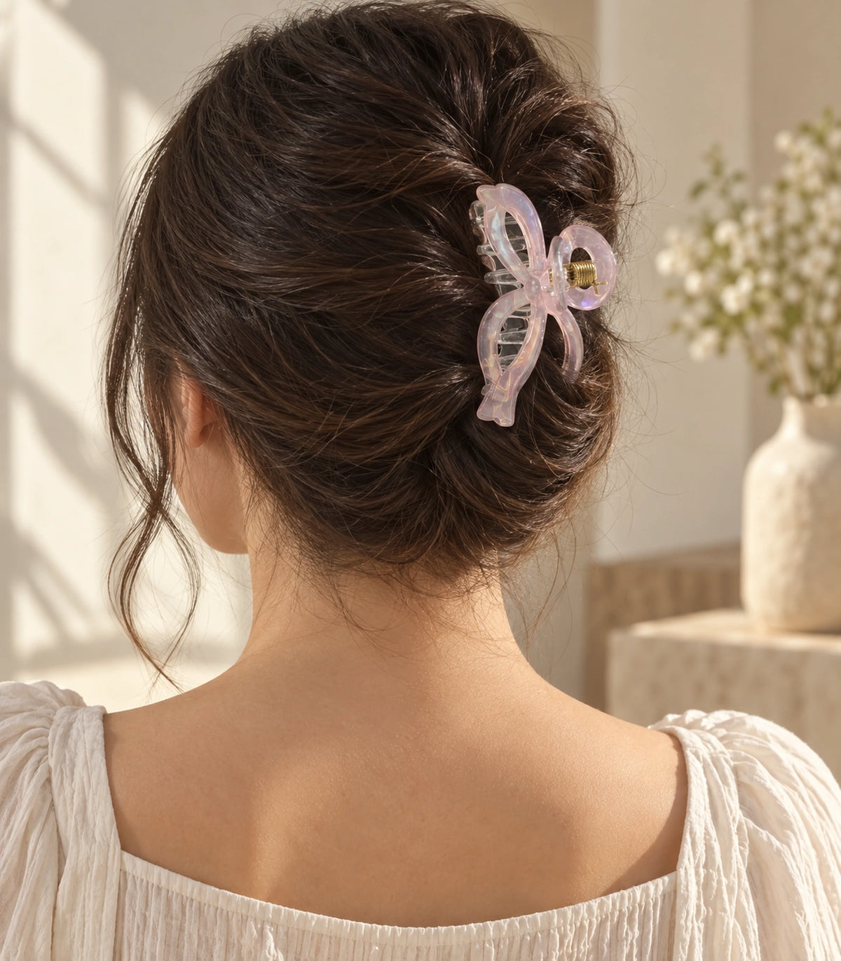 JIMIKI Pale Pink Iridescent Bow Hair Claw Clips in Pale Pink, editorial model view