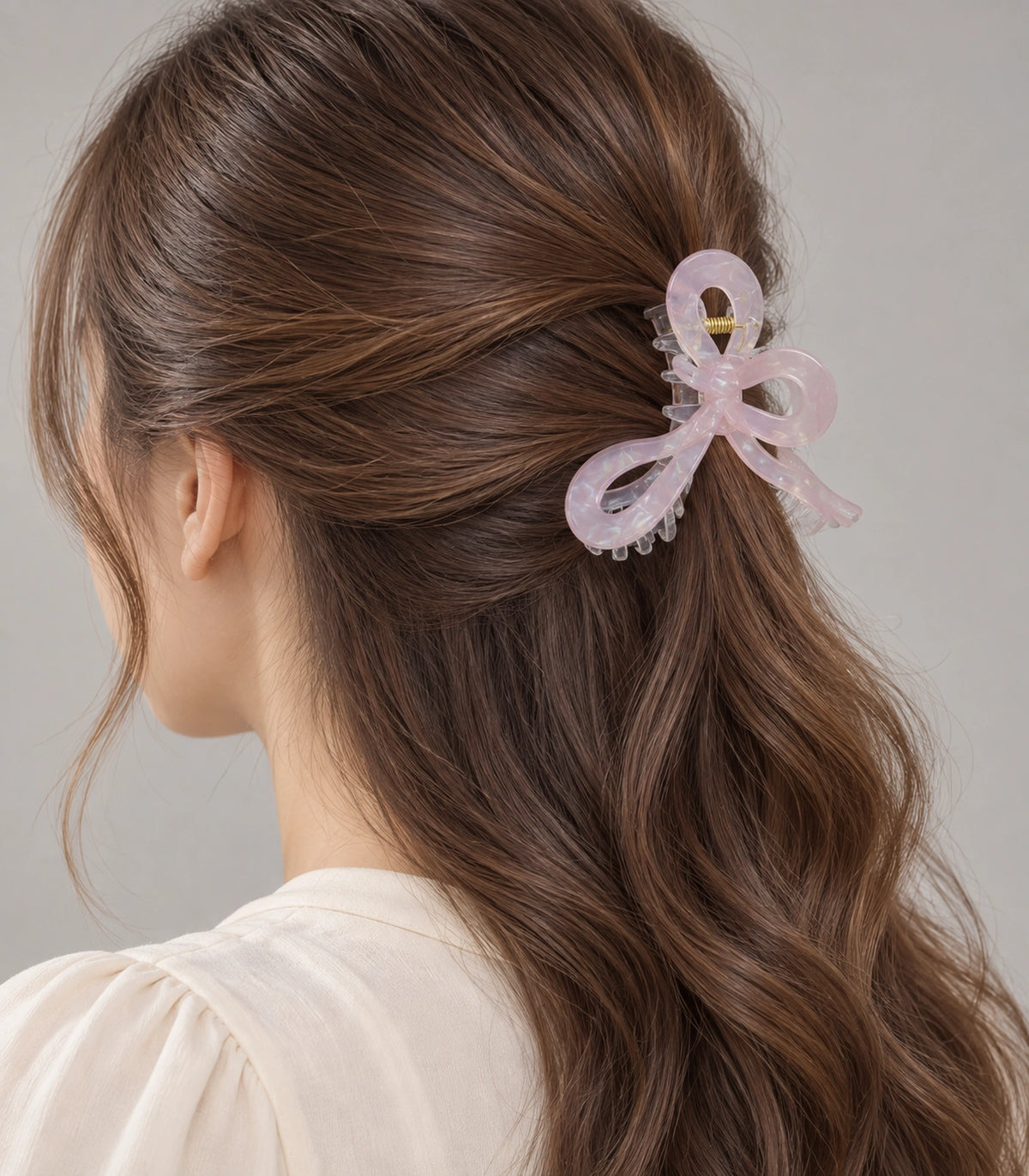 JIMIKI Pale Pink Iridescent Bow Hair Claw Clips in Pale Pink, model wearing view