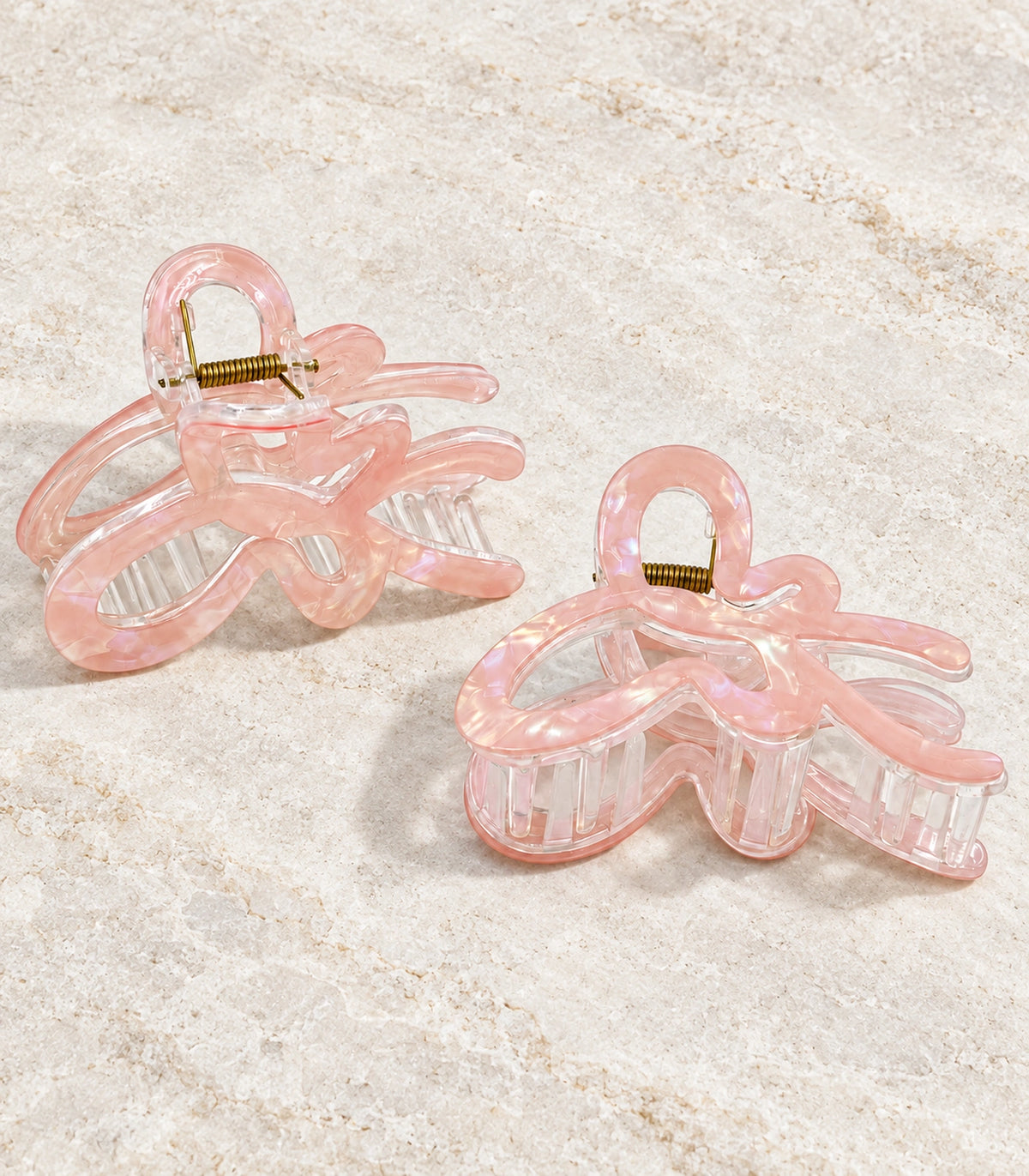 JIMIKI Iridescent Butterfly Hair Claw Clips in Peach, editorial flat lay #color_peach