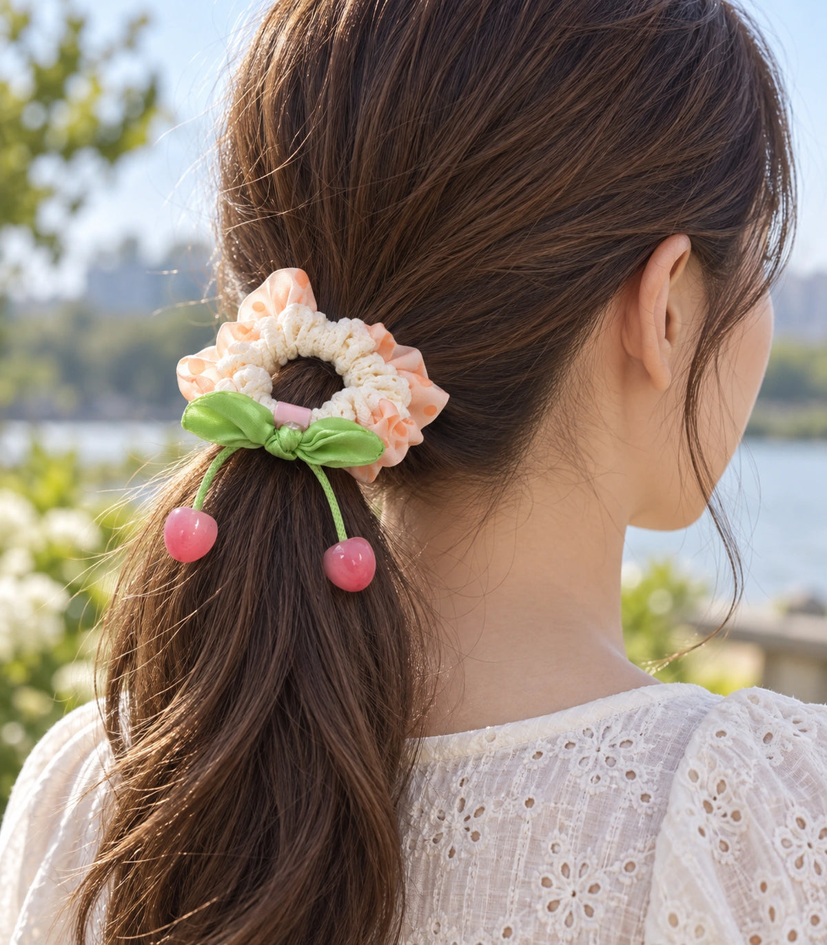 JIMIKI Polka Dot Lace Scrunchie With Cherry Charms in Peach, editorial model view #color_peach