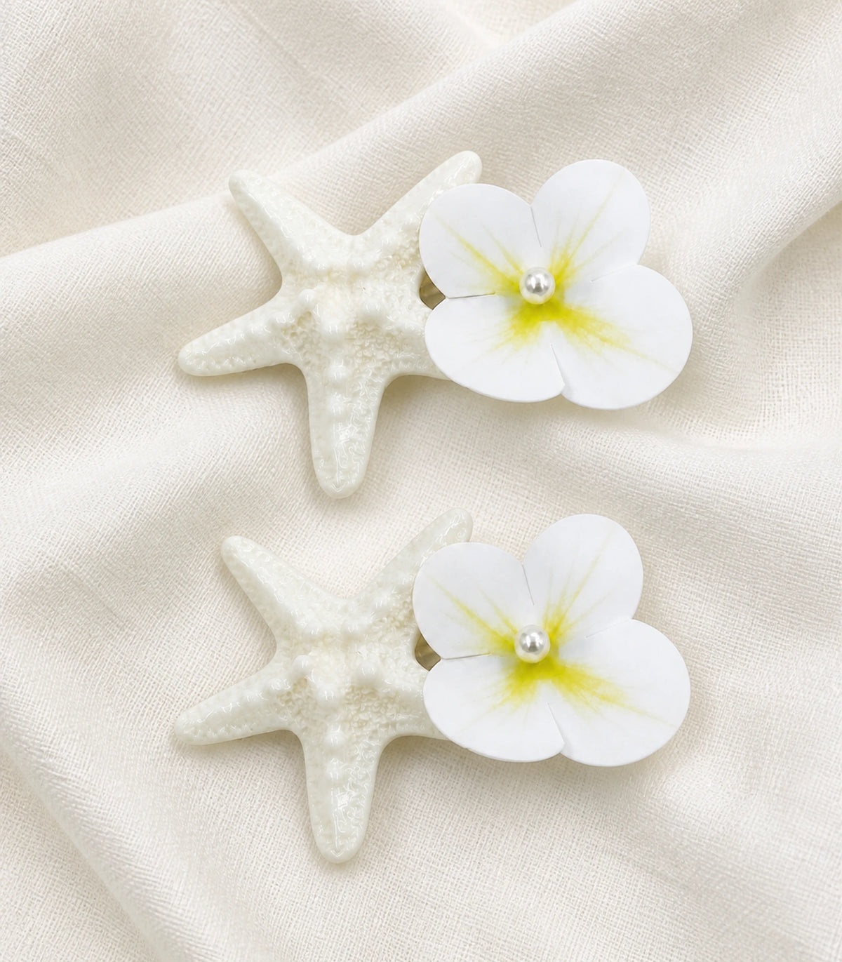 Editorial flat lay of the Pearly Starfish Flower Clip Pair