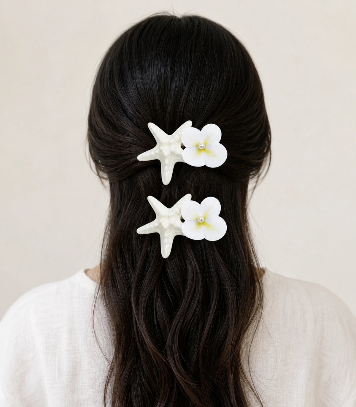 Model wearing the Pearly Starfish Flower Clip Pair