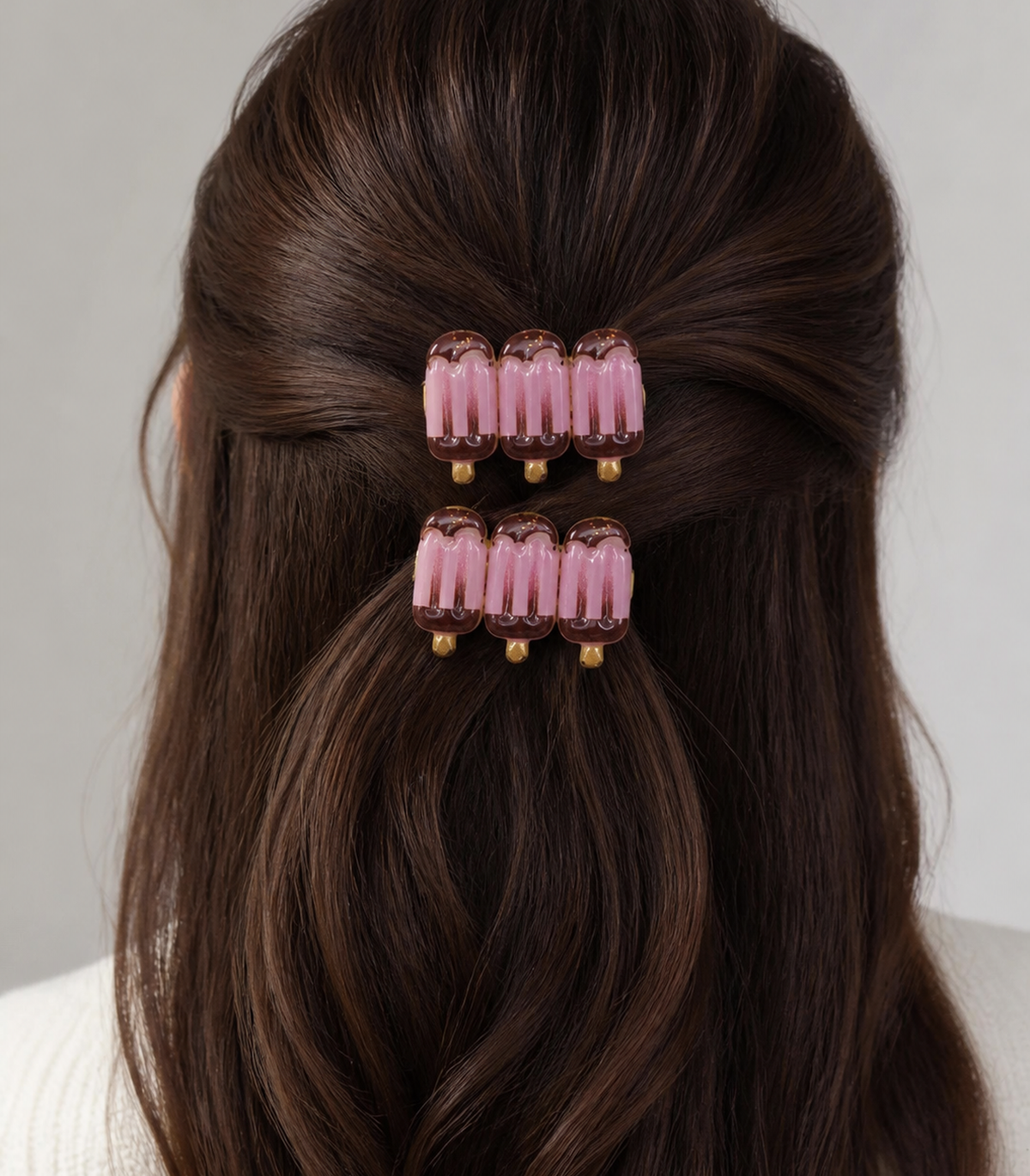 Pink Chocolate Iced Pop Trio Clip Pair in a styled editorial view