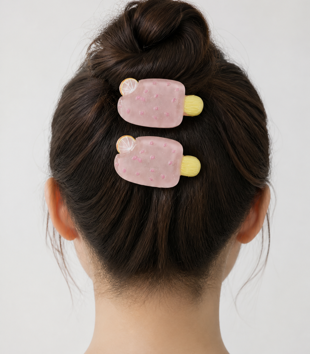Pink Citrus Ice Pop Barrette Pair styled editorial view