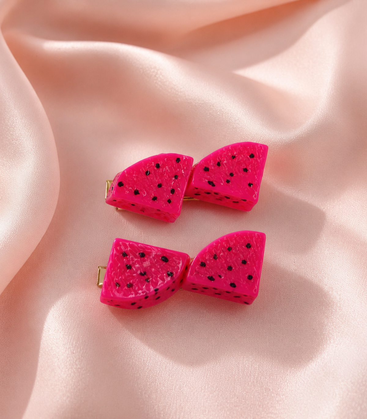 Pink Dragonfruit Duo Clip Pair in an editorial flat lay
