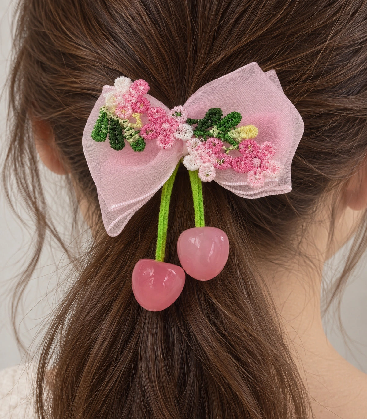 JIMIKI Pink Embroidered Bow Hair Clip with Cherry Charms in Pink, close-up detail