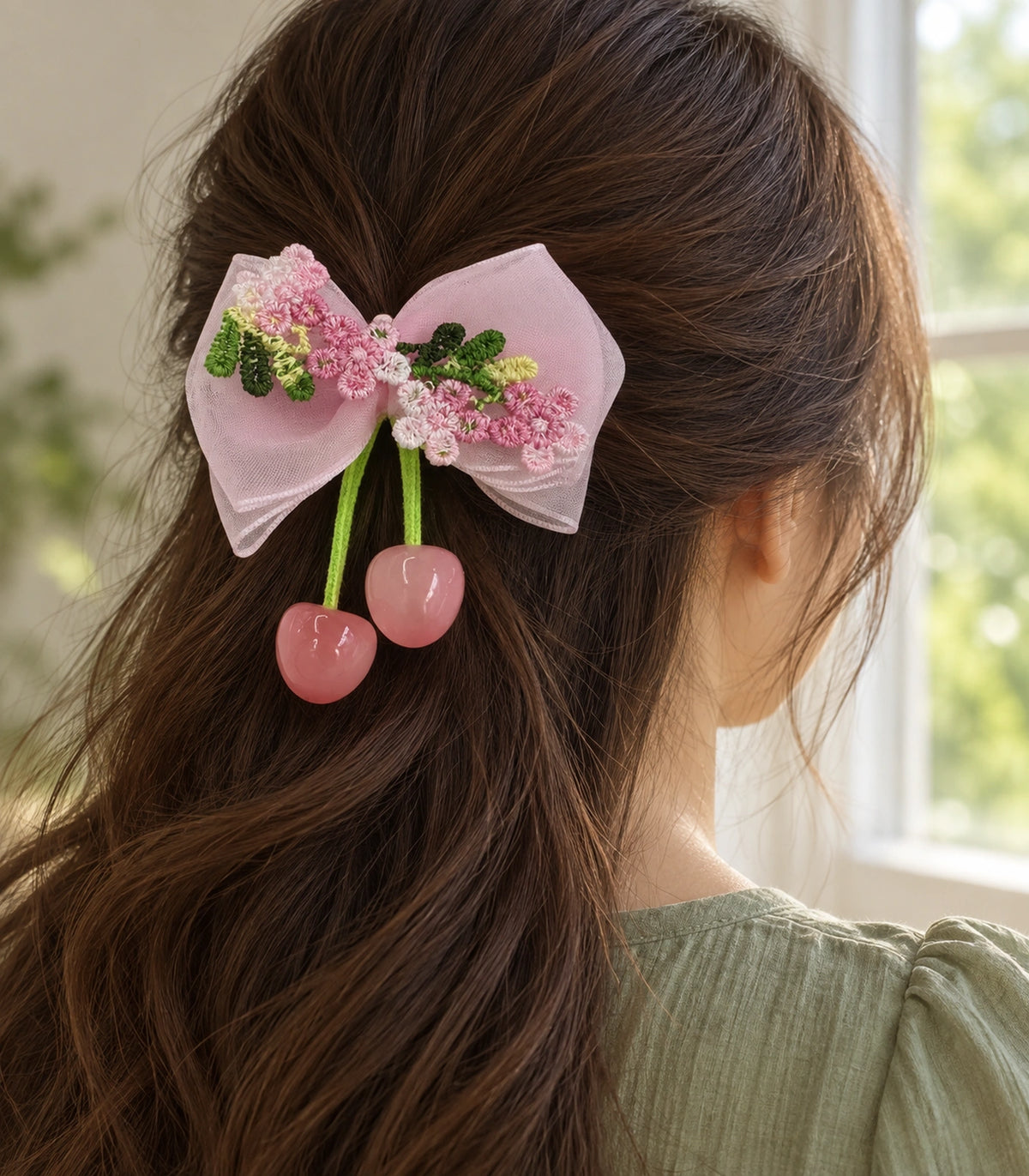 JIMIKI Pink Embroidered Bow Hair Clip with Cherry Charms in Pink, editorial model view
