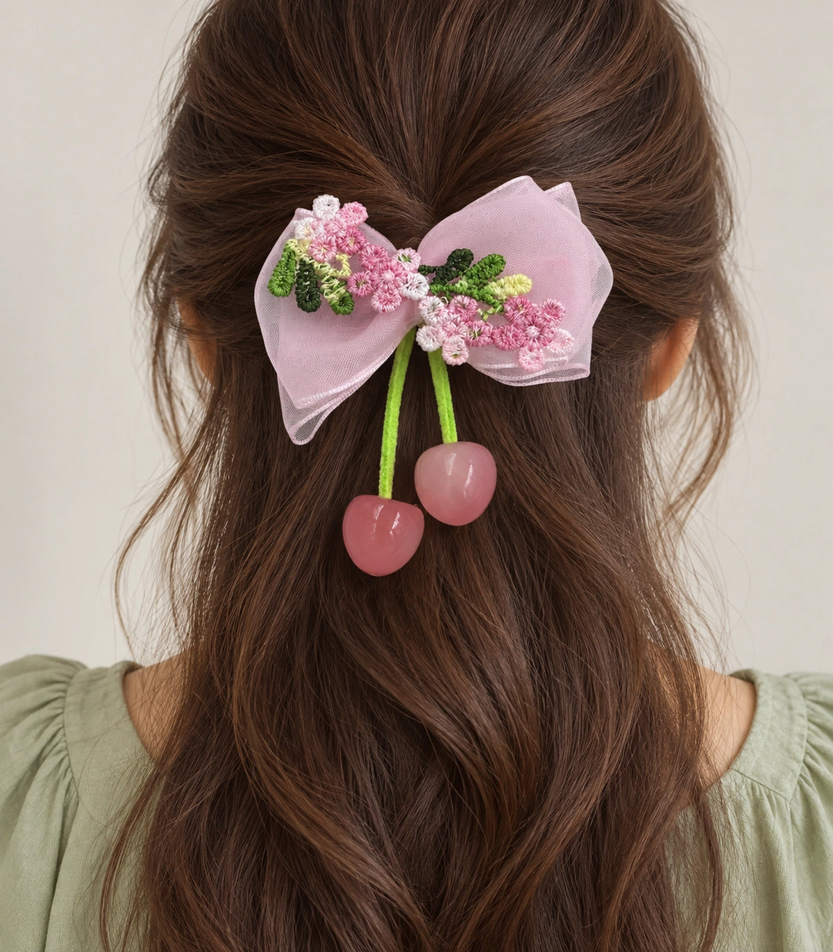 JIMIKI Pink Embroidered Bow Hair Clip with Cherry Charms in Pink, model wearing view