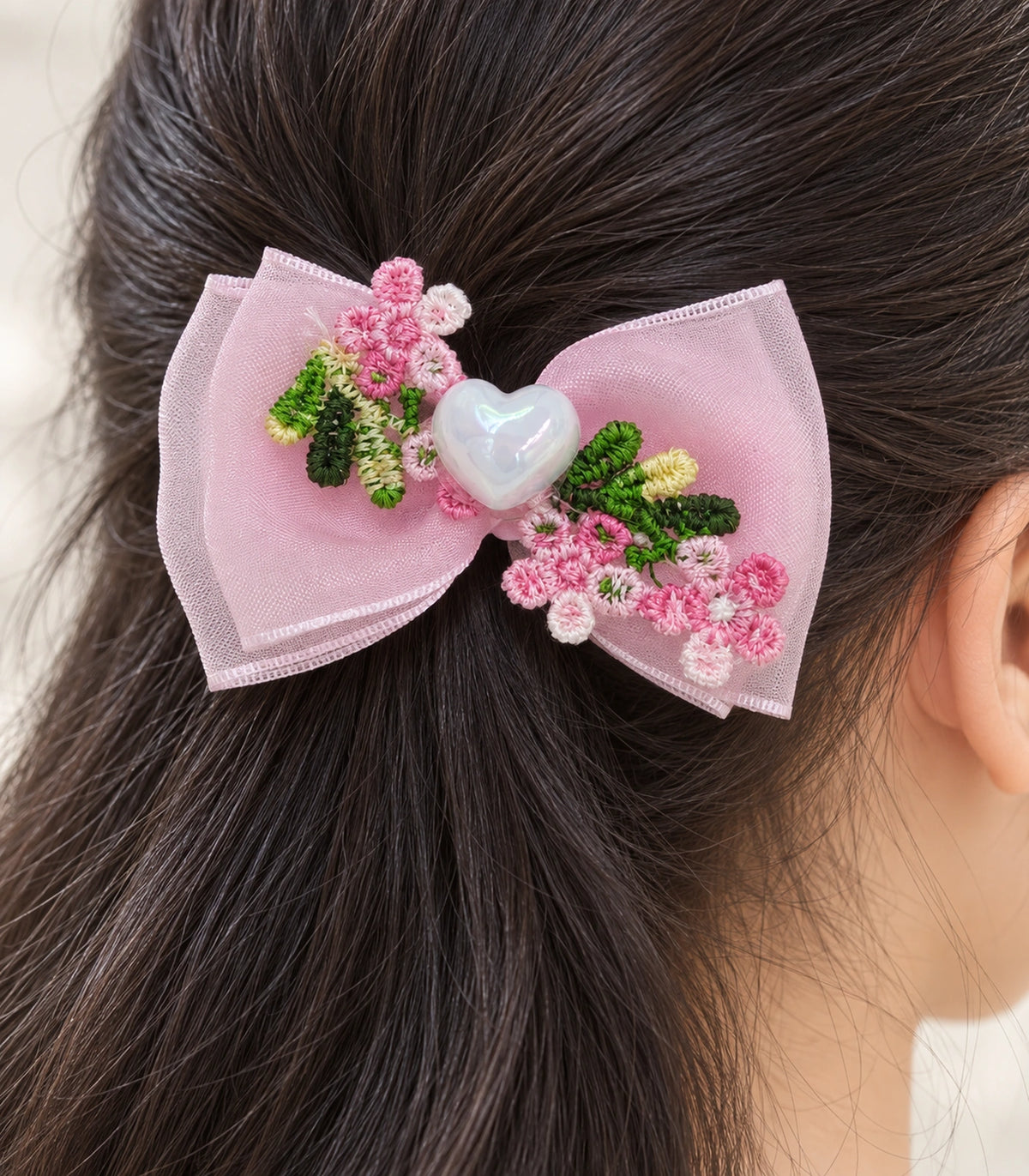 JIMIKI Pink Floral Pearl Heart Bow Hair Clip in Pink / Multicolor, close-up detail