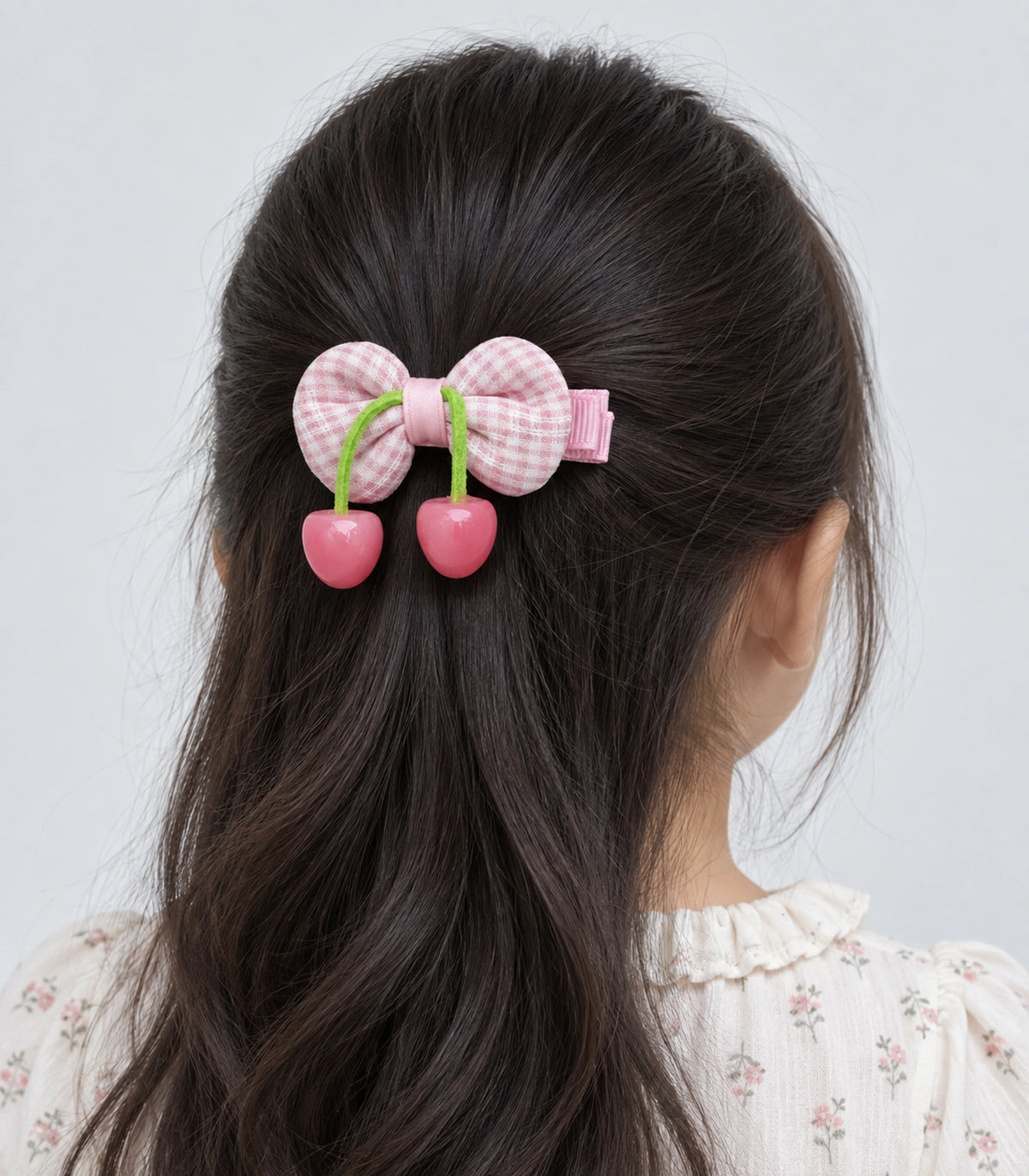 JIMIKI Pink Gingham Bow Hair Clip with Cherry Charms in Pink, model wearing view