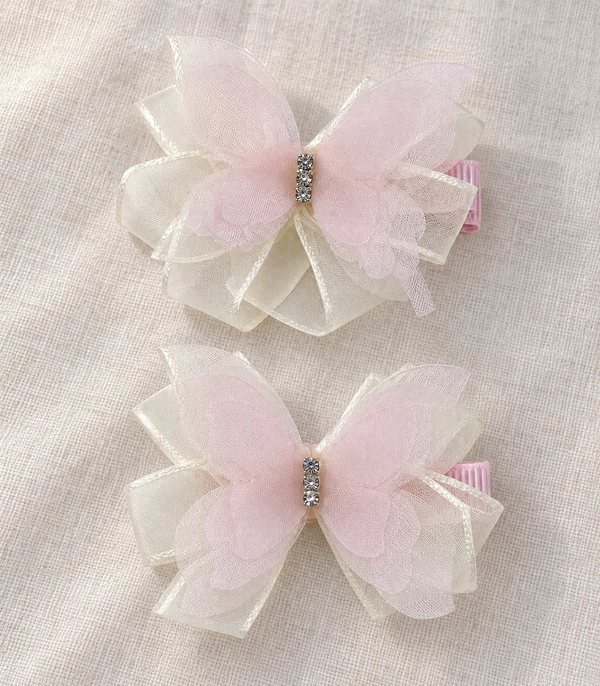 JIMIKI Organza Butterfly Bow Hair Clips in Pink, editorial flat lay #color_pink