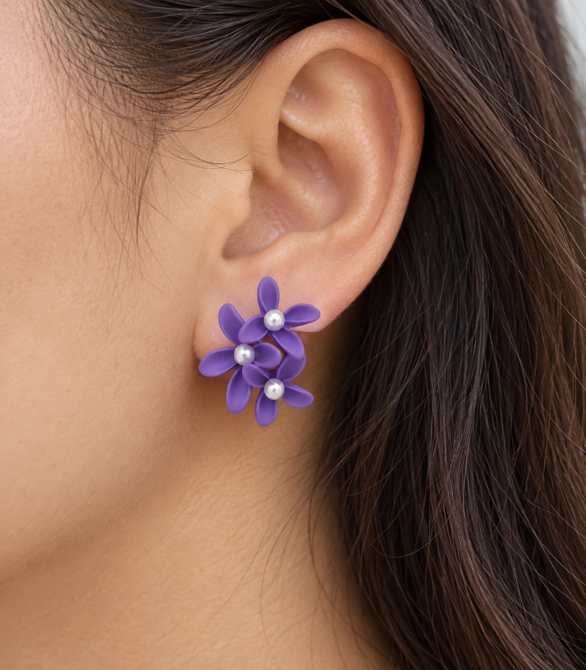 JIMIKI Purple cascading floral cluster stud earrings, close-up of the three pearl-like centres and curved petals #color_purple