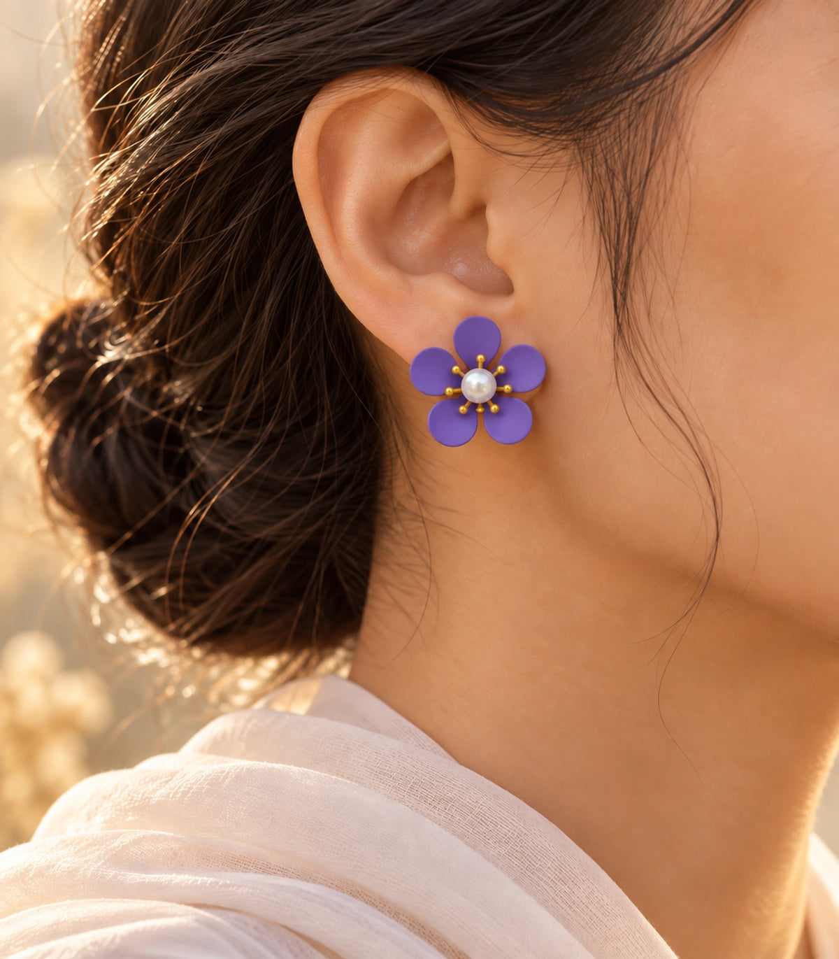 JIMIKI purple five-petal flower stud earrings with pearl-effect centre, alternate styled worn view of flower stud #color_purple