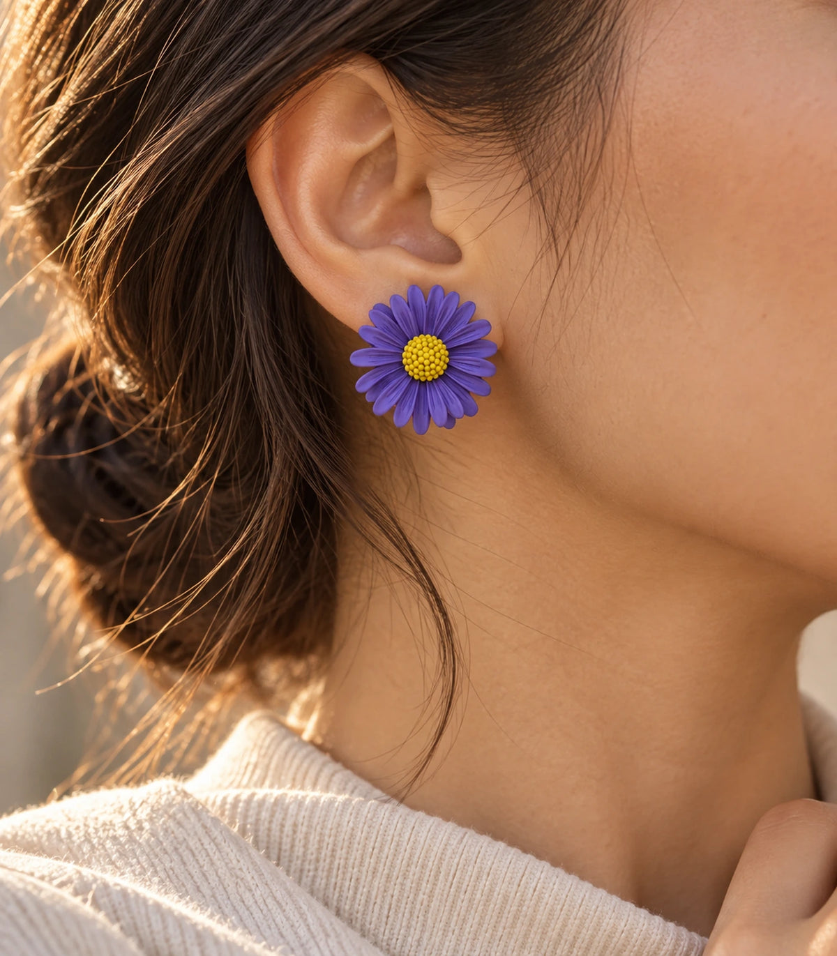 JIMIKI Purple yellow centre daisy stud earrings, earring worn in a warm editorial setting #color_purple