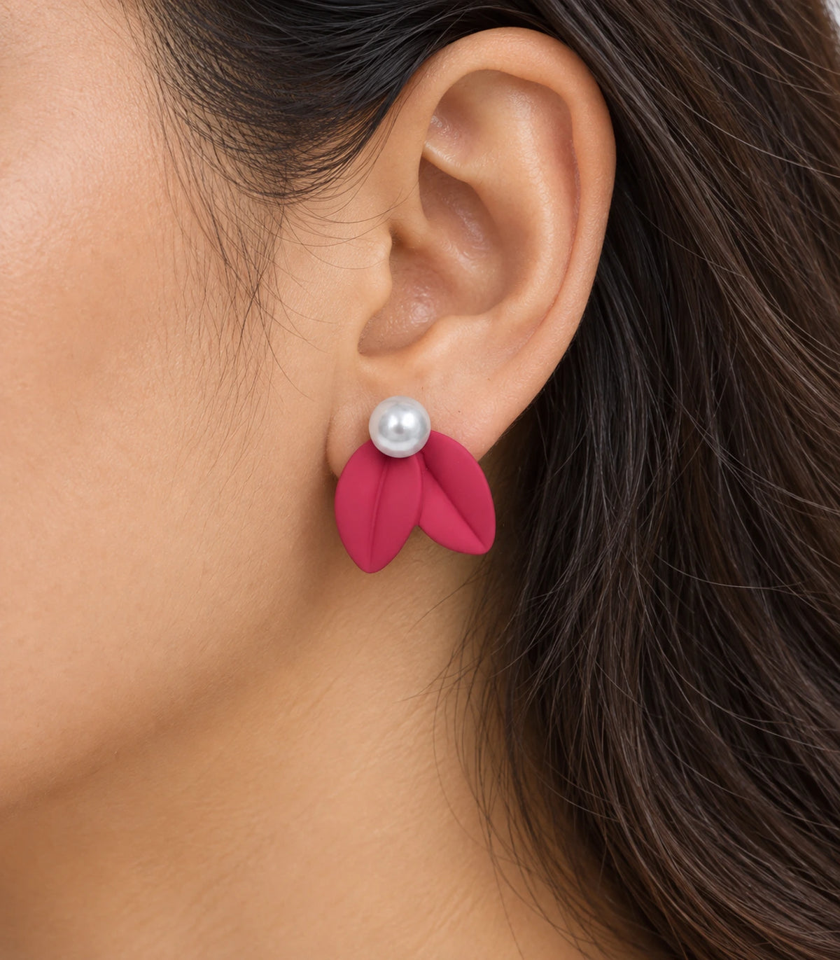 JIMIKI Double Leaf Pearl Stud Earrings in Raspberry Pink — close-up of the earring worn on the ear #color_raspberry pink