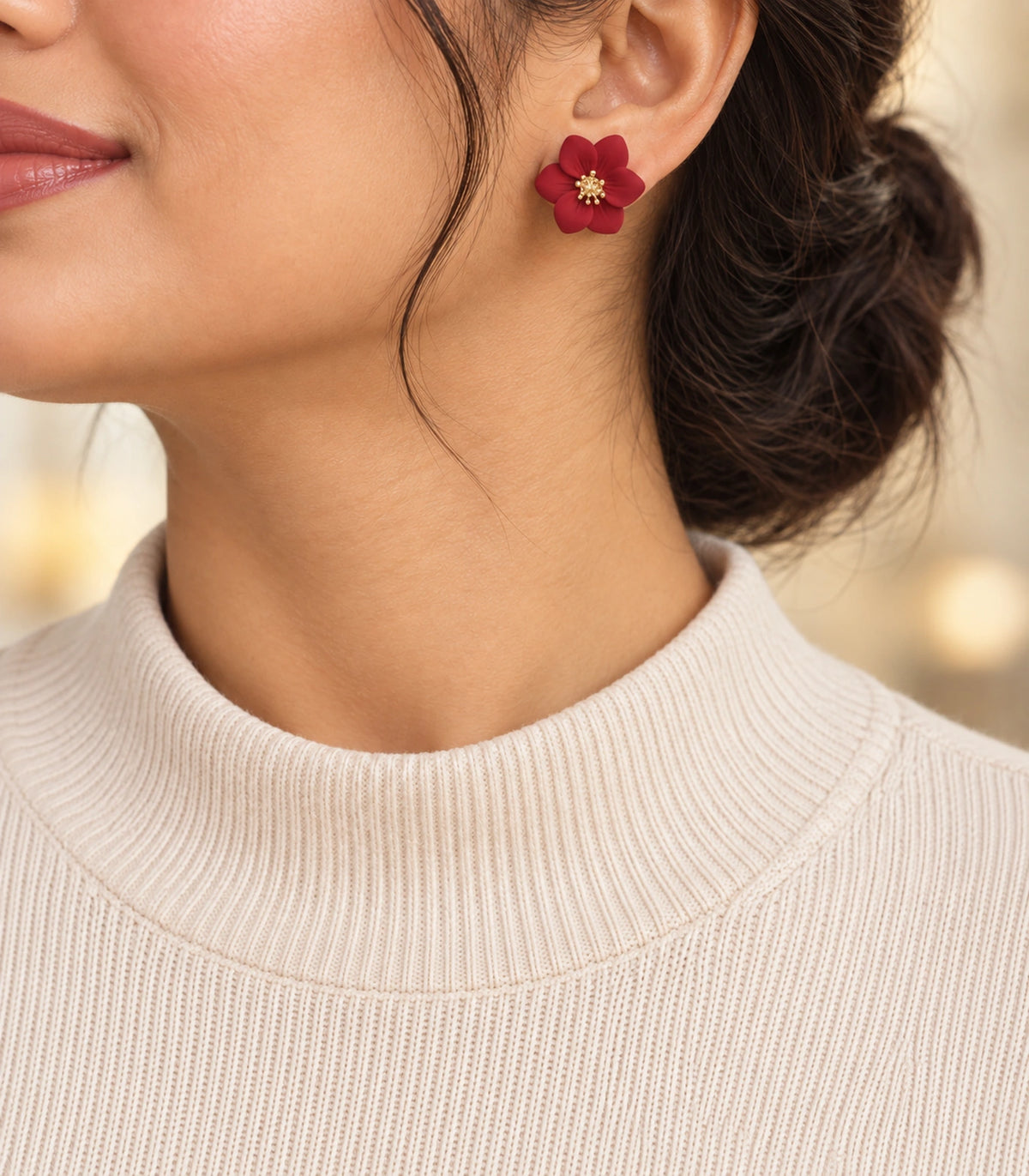 JIMIKI Red compact six petal flower stud earrings, styled portrait showing the flower stud at the ear #color_red