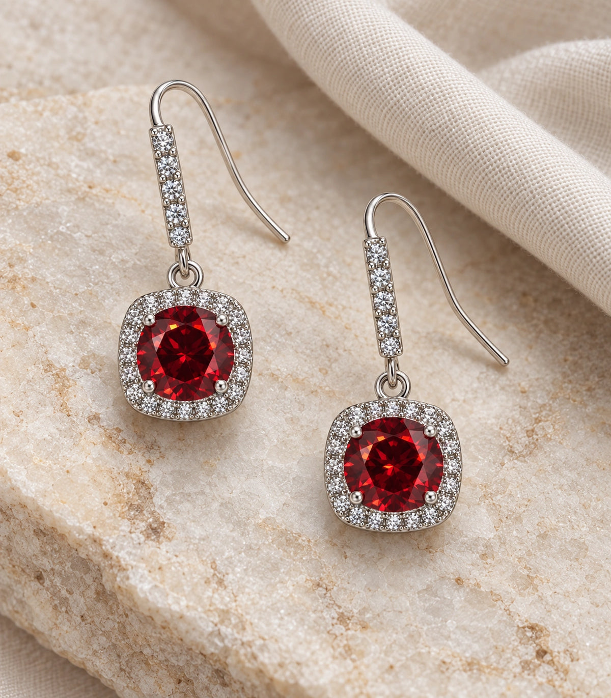 JIMIKI Crystal Cushion Halo Hook Earring Pair in Silver tone / red, editorial flat lay #color_silver tone / red