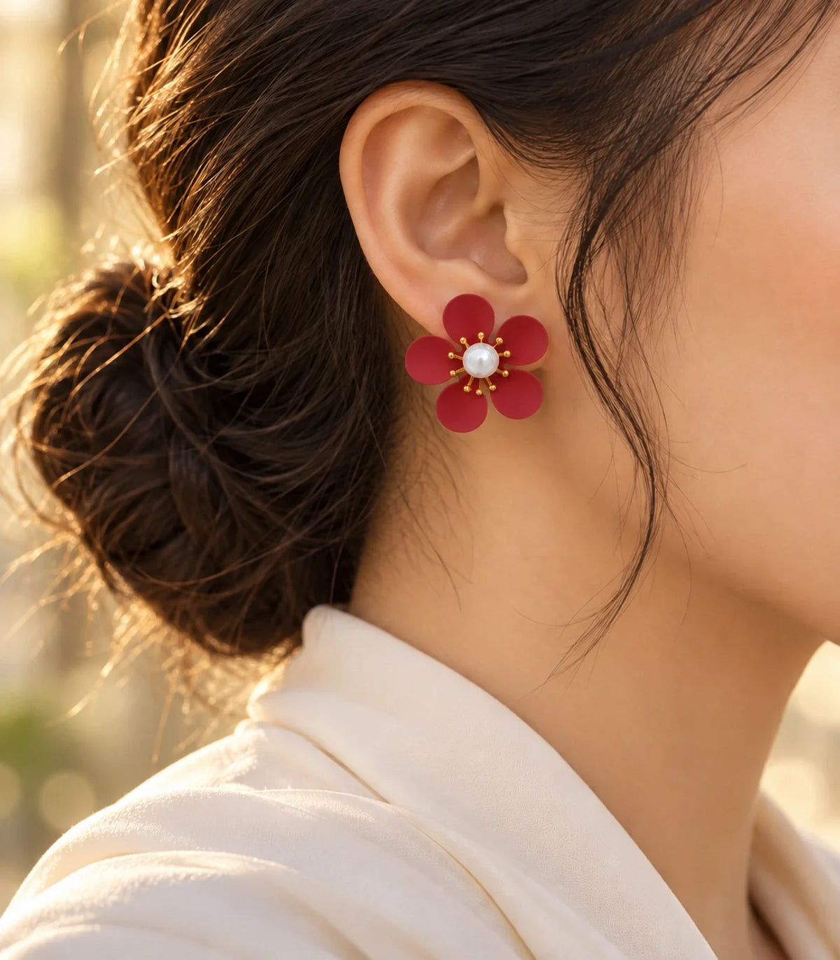 Red five-petal pearl flower stud earrings editorial model