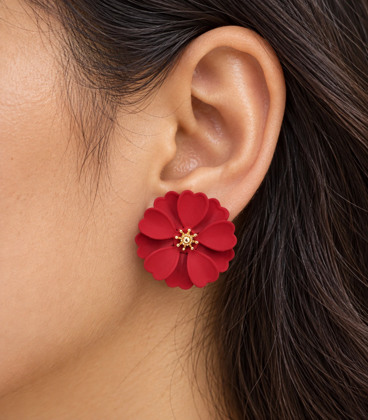 JIMIKI Red Layered Daisy Stud Earrings - layered scalloped petals and gold-tone centre worn close-up #color_red