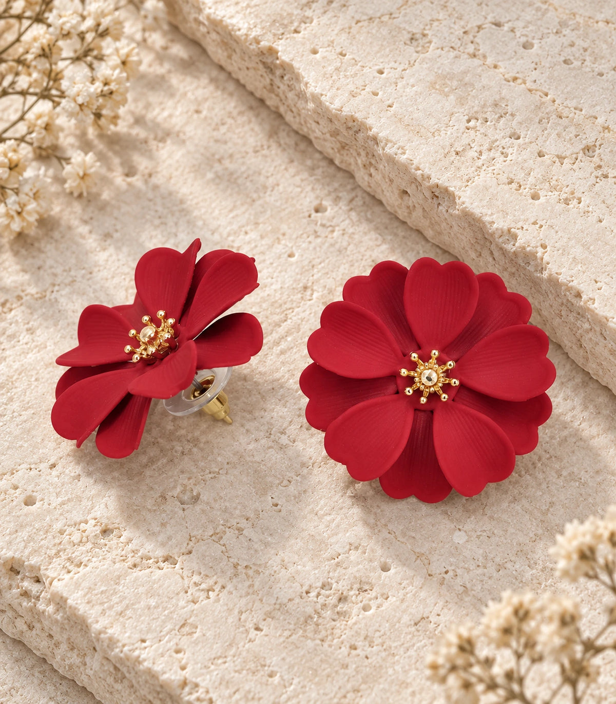 JIMIKI Red Layered Daisy Stud Earrings - pair in styled flatlay #color_red