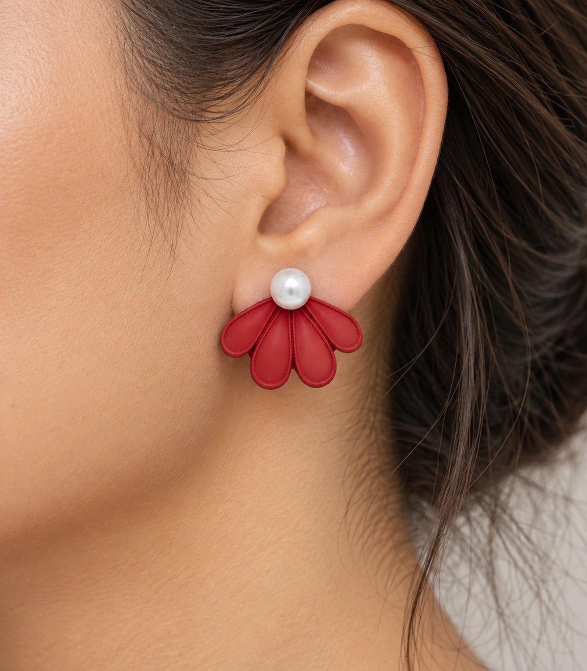 JIMIKI Red pearl fan petal stud earrings, worn closeup of four petals and pearl-style bead #color_red