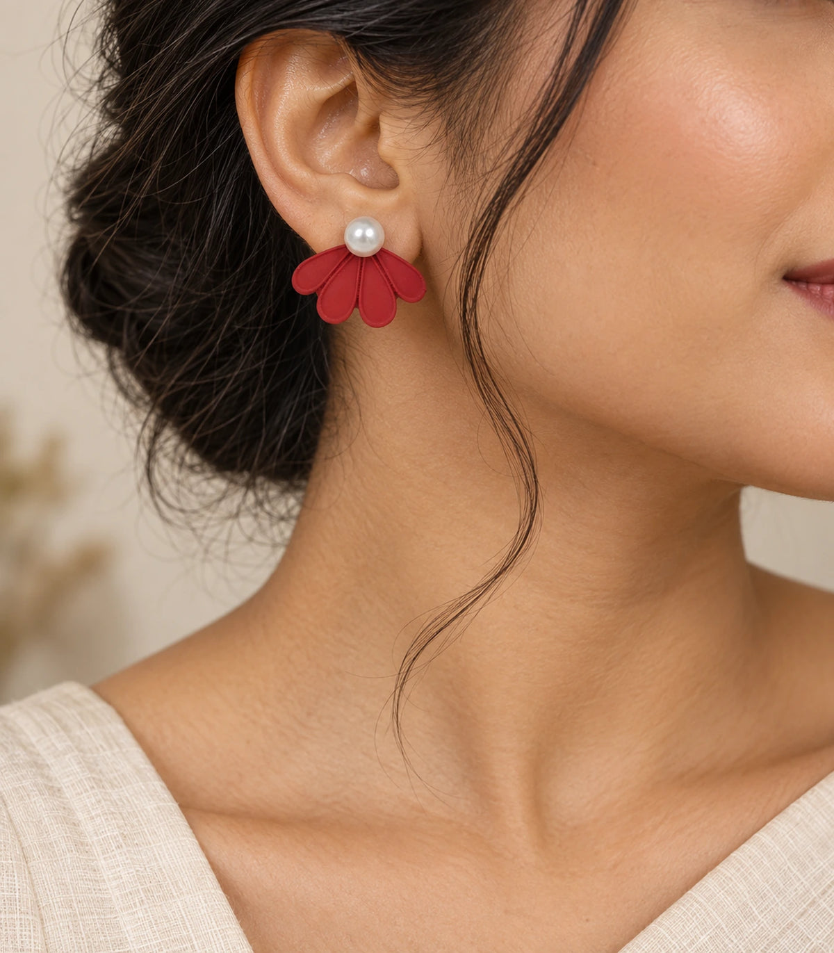 JIMIKI Red pearl fan petal stud earrings, styled worn editorial view #color_red