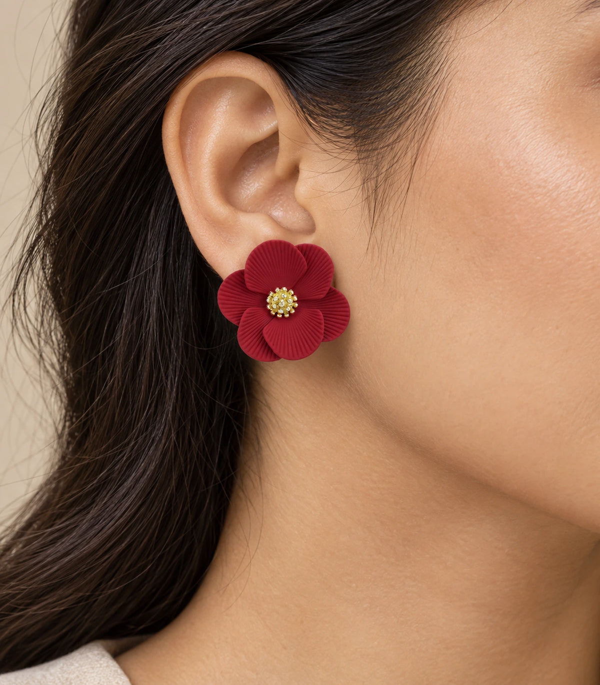 JIMIKI Red ribbed flower stud earrings, worn view showing the flower stud #color_red
