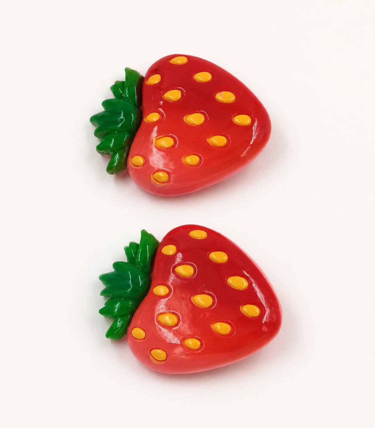 Close-up of the Red Strawberry Clip Pair details