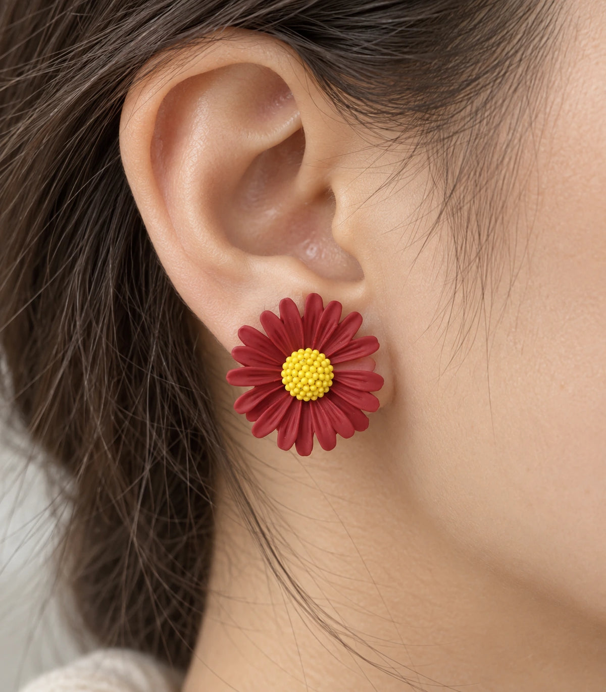 JIMIKI Red yellow centre daisy stud earrings, close-up of grooved petals and yellow centre #color_red