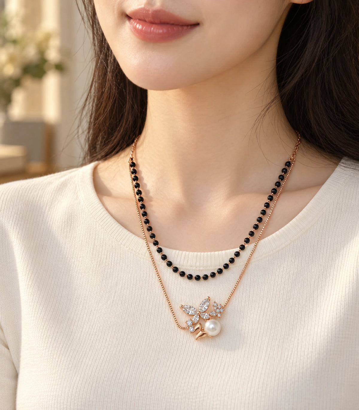 JIMIKI Rose-Gold Black-Bead Crystal-Butterfly Pearl Layered Necklace in Rose Gold / Black - editorial worn view #color_rose-gold-black