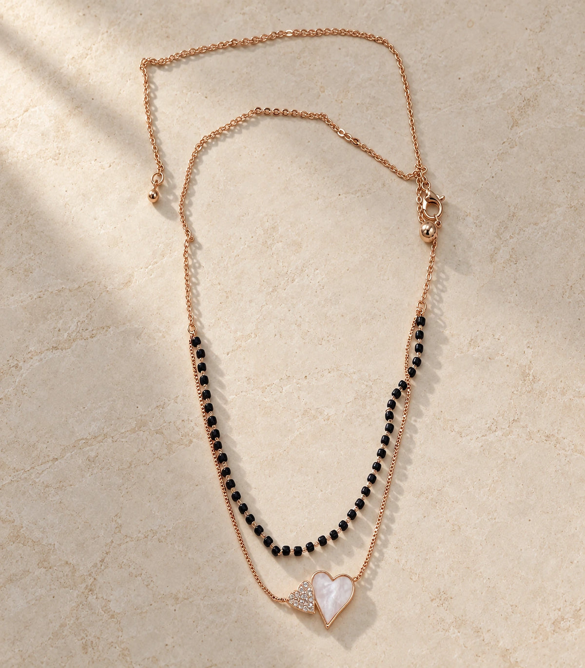 Rose Gold Black Bead Nacre Heart Layered Necklace – editorial flatlay