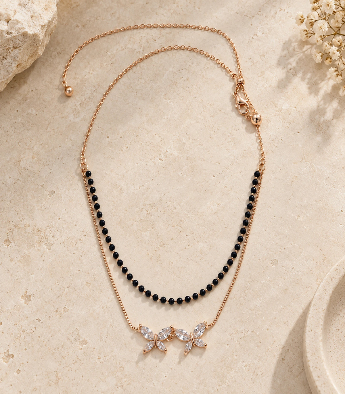 Rose Gold Black Bead Twin Butterfly Layered Necklace – editorial flatlay