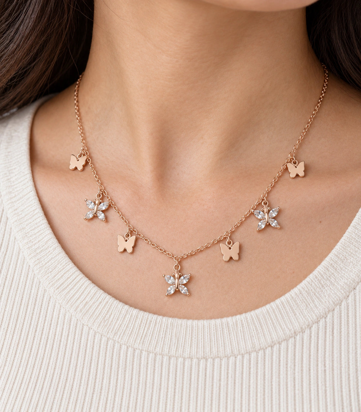 JIMIKI Rose Gold Mixed Butterfly Charm Necklace in Rose Gold - close-up details #color_rose-gold