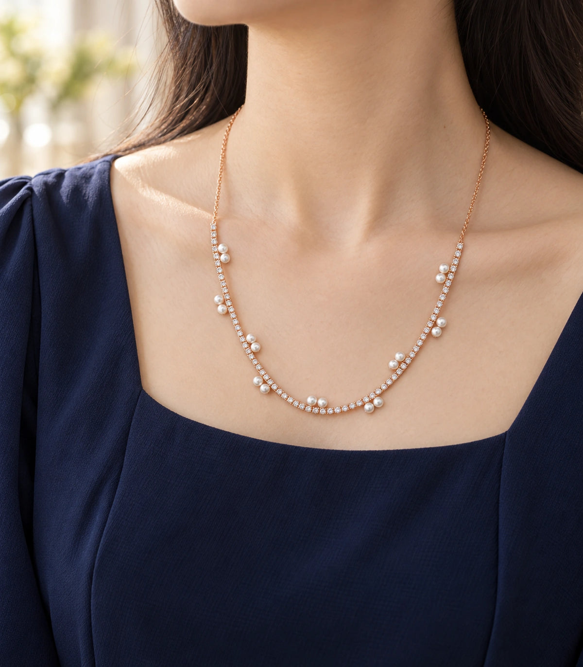 JIMIKI Rose Gold Paired Pearl Crystal Tennis Necklace in Rose Gold - editorial worn view #color_rose-gold