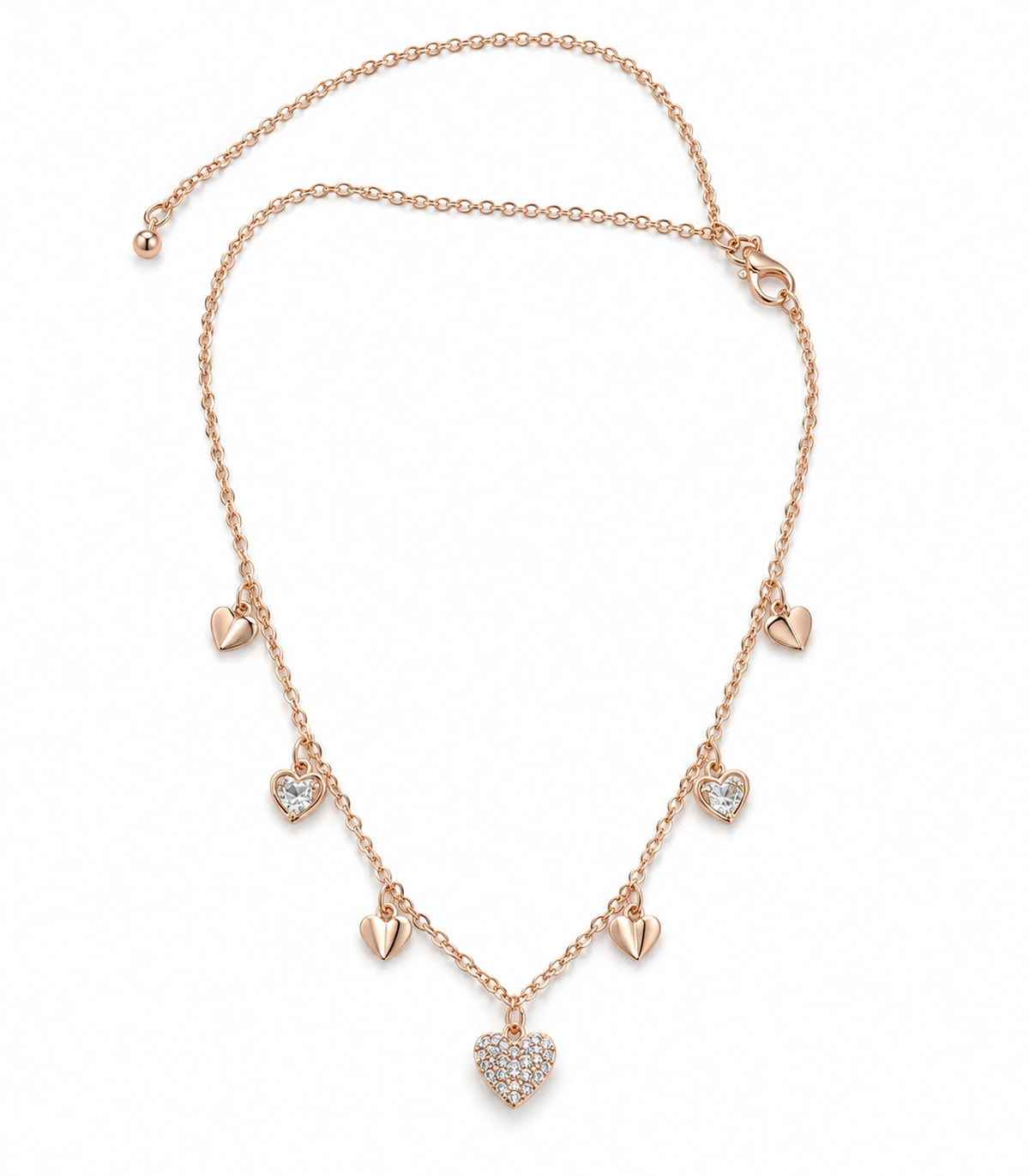 JIMIKI rose gold-tone seven heart charm necklace, full necklace on white with seven alternating heart charms #color_rose-gold