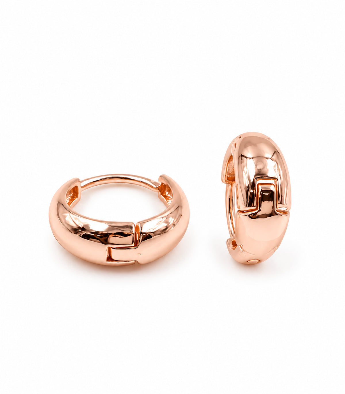 Rose-gold-tone smooth chunky hoop earring pair on a white background.