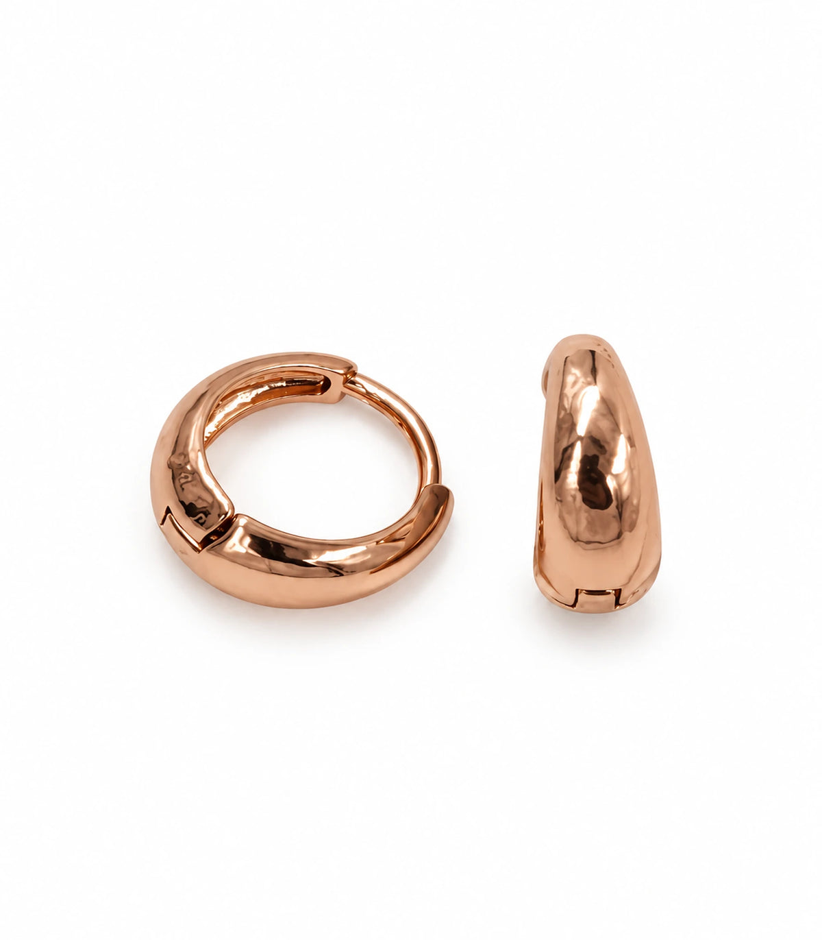 JIMIKI Smooth Tapered Huggie Earrings in Rose Gold Tone — pair on white background #color_rose-gold-tone