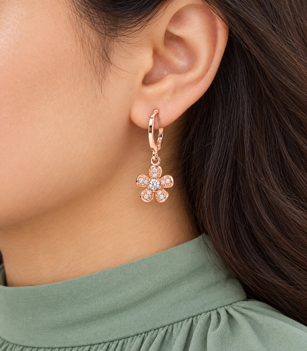 Five-petal crystal flower hoop earring with central clear crystal, close view