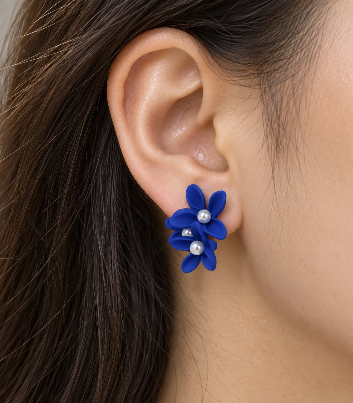 JIMIKI Royal Blue cascading floral cluster stud earrings, close-up of the three pearl-like centres and curved petals #color_royal blue